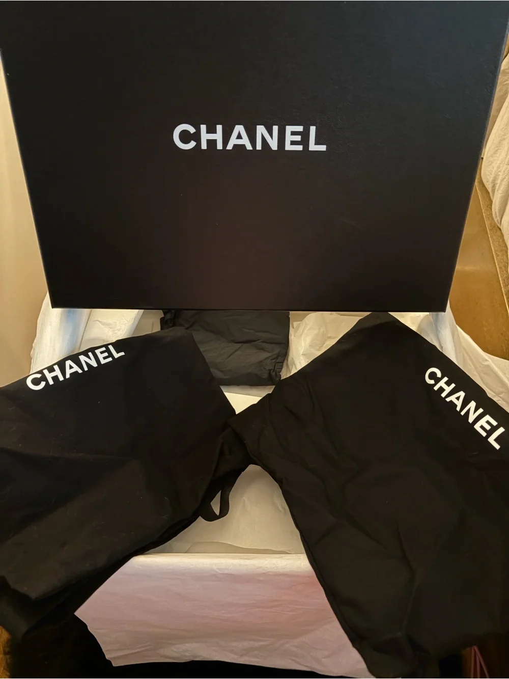 CHANEL Black Suede Platform Sandals with Bow and Pearl Heel Accent